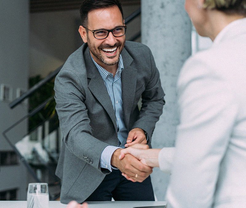 Man shaking womans hand