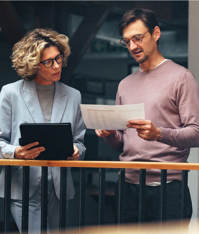 Two professionals reviewing document