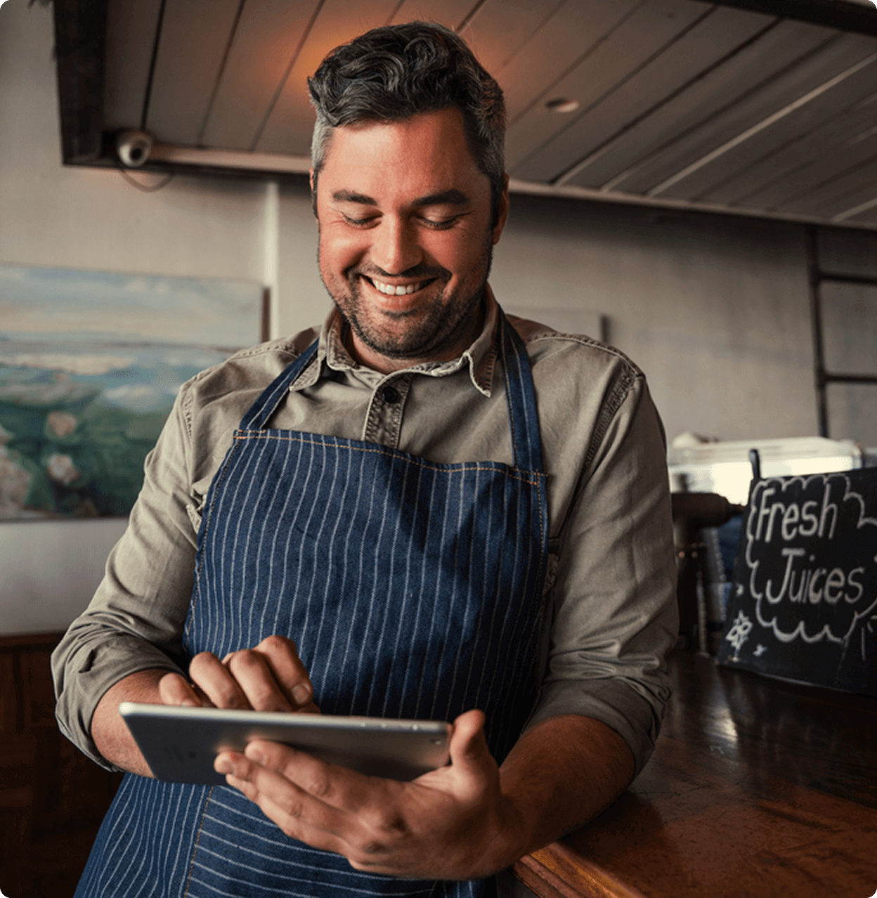 Restaurant worker taking orders on an ipaid