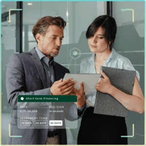 Male and female professionals looking at a tablet with short-term financing information on the screen