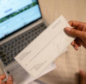 Person inspecting paper check