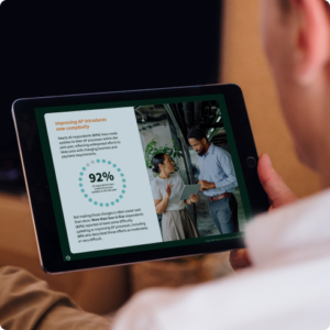 Man holding iPad reviewing report