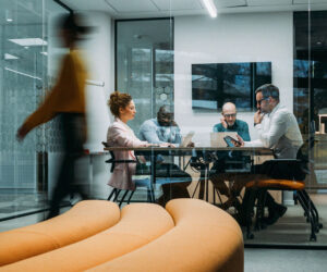 Business team discussing an integrated payment platform in a modern conference room.